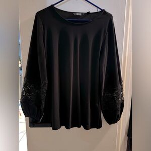 Elegant soft blouse with lace details on the sleeves